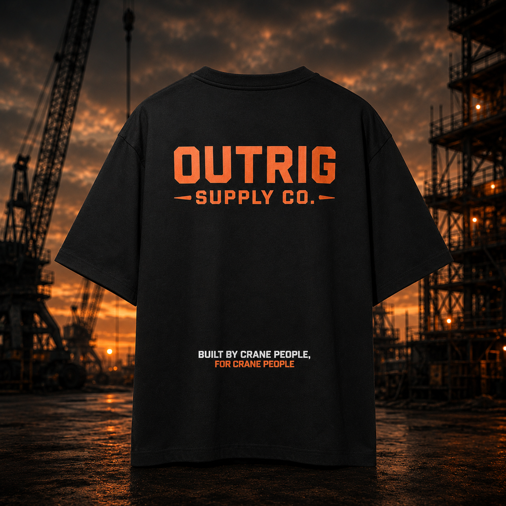 Black t-shirt with 'OUTRIG SUPPLY CO.' text against a construction site backdrop