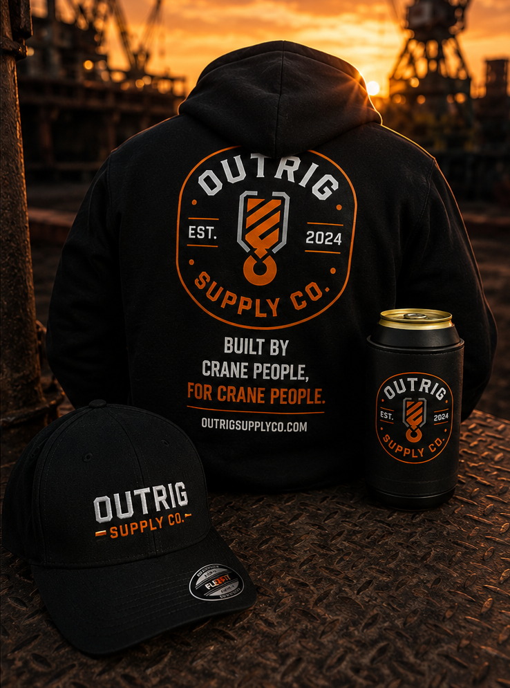 Person wearing a black hoodie with 'Outrig Supply Co.' branding, accompanied by a cap and can cooler in an industrial setting.