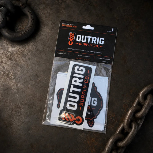 Outrig Supply Co Core Sticker Pack displayed on an industrial workbench with chain.