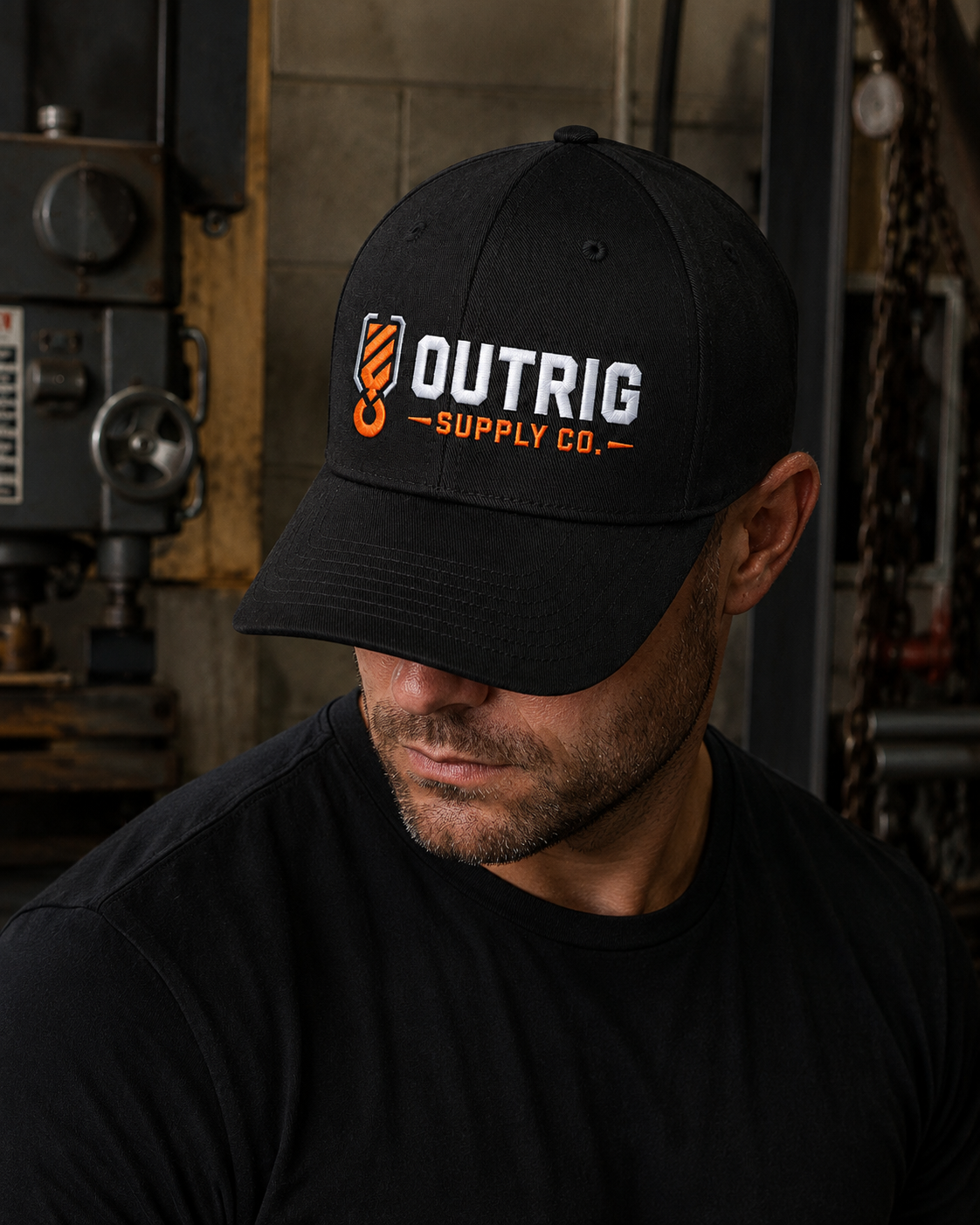 Outrig Core Flexfit Cap showing the embroidered orange-and-white logo.