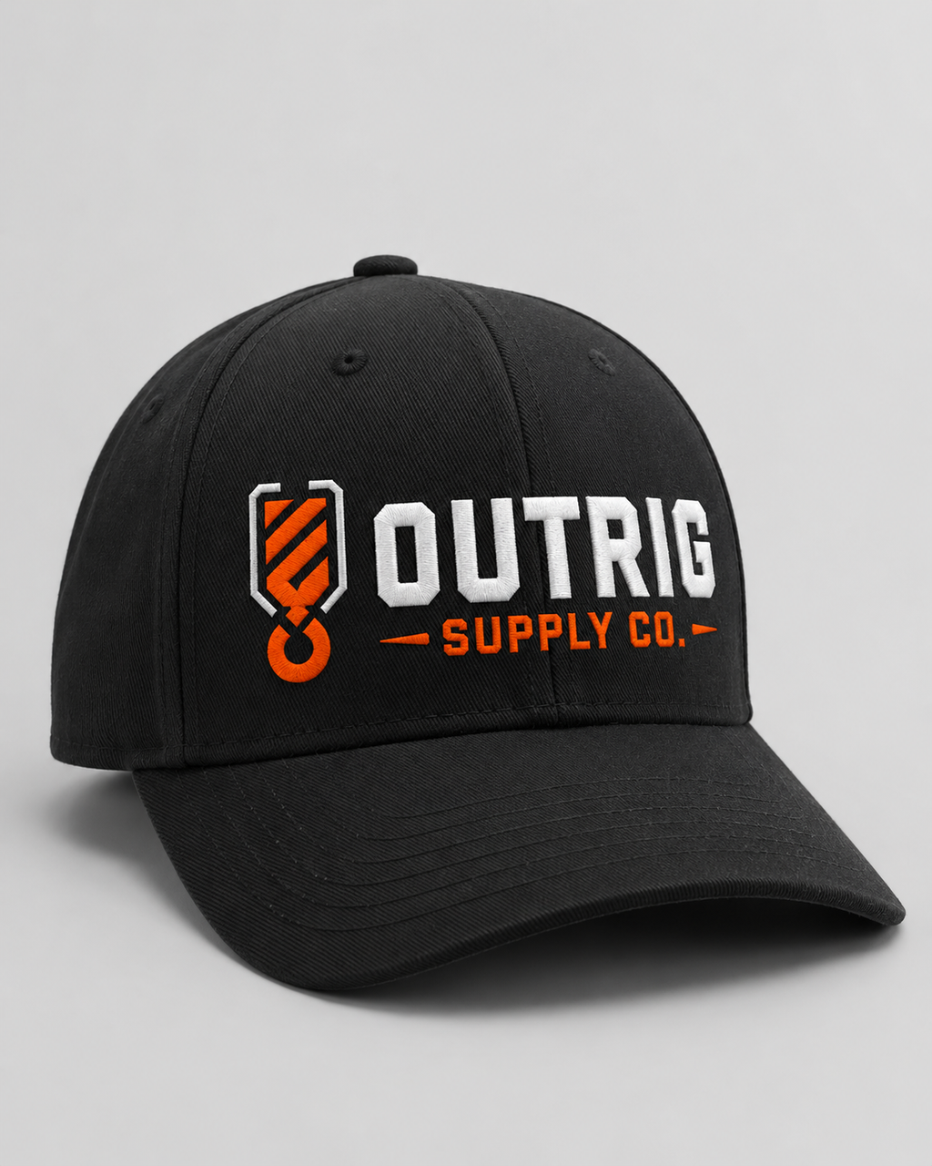 Black Outrig Core Flexfit Cap with orange-and-white Outrig Supply Co logo.