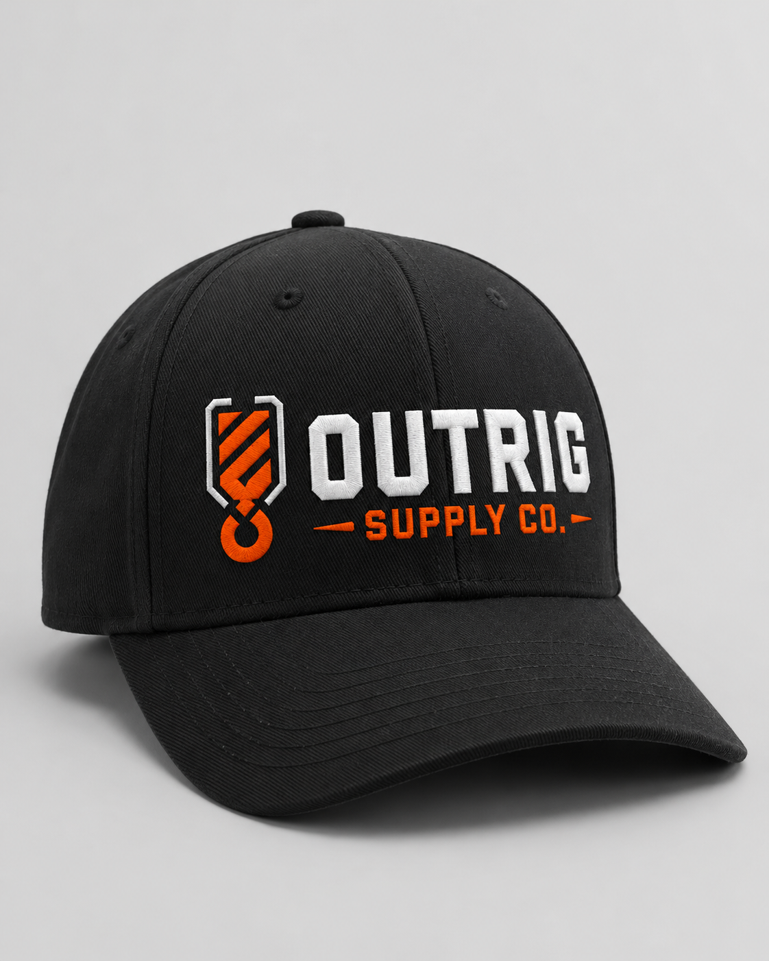 Black Outrig Core Flexfit Cap with orange-and-white Outrig Supply Co logo.