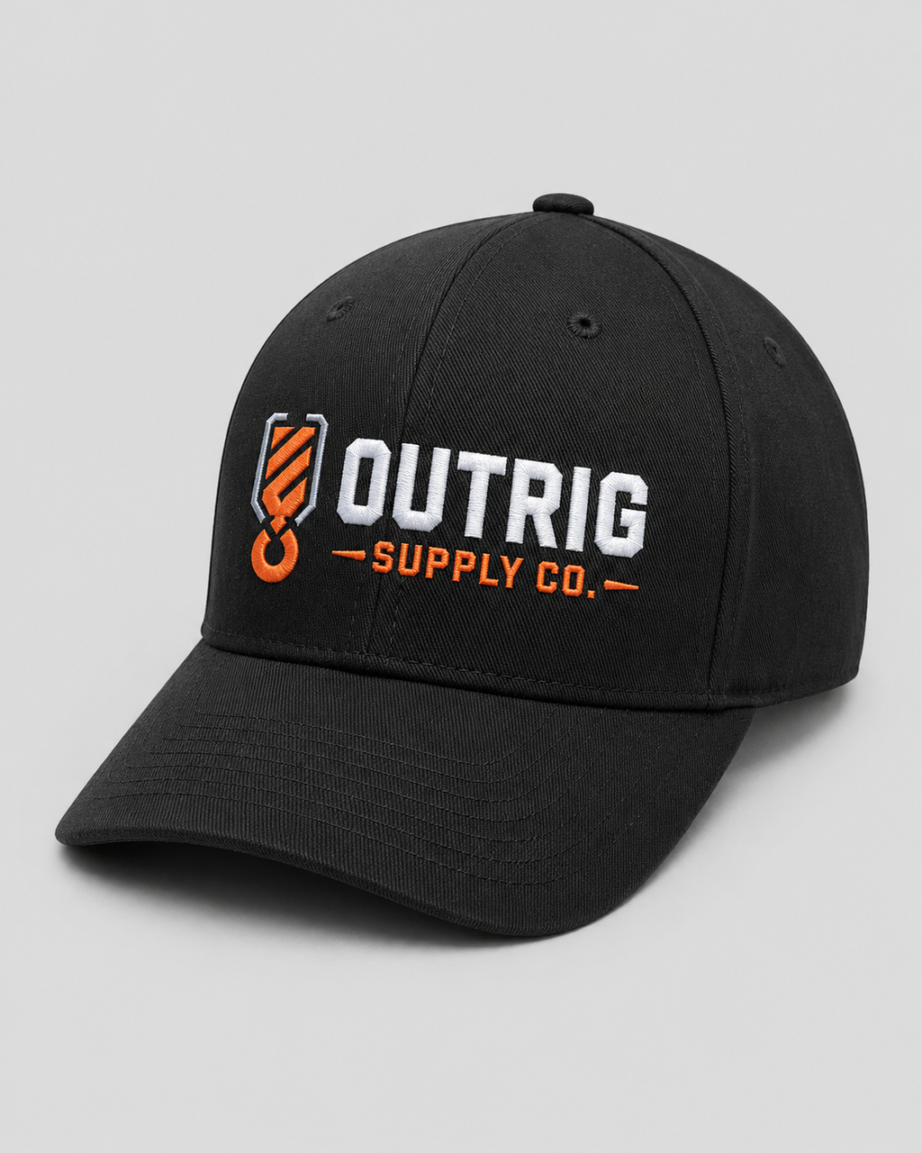 Detail view of the Outrig Core Flexfit Cap and embroidered branding.